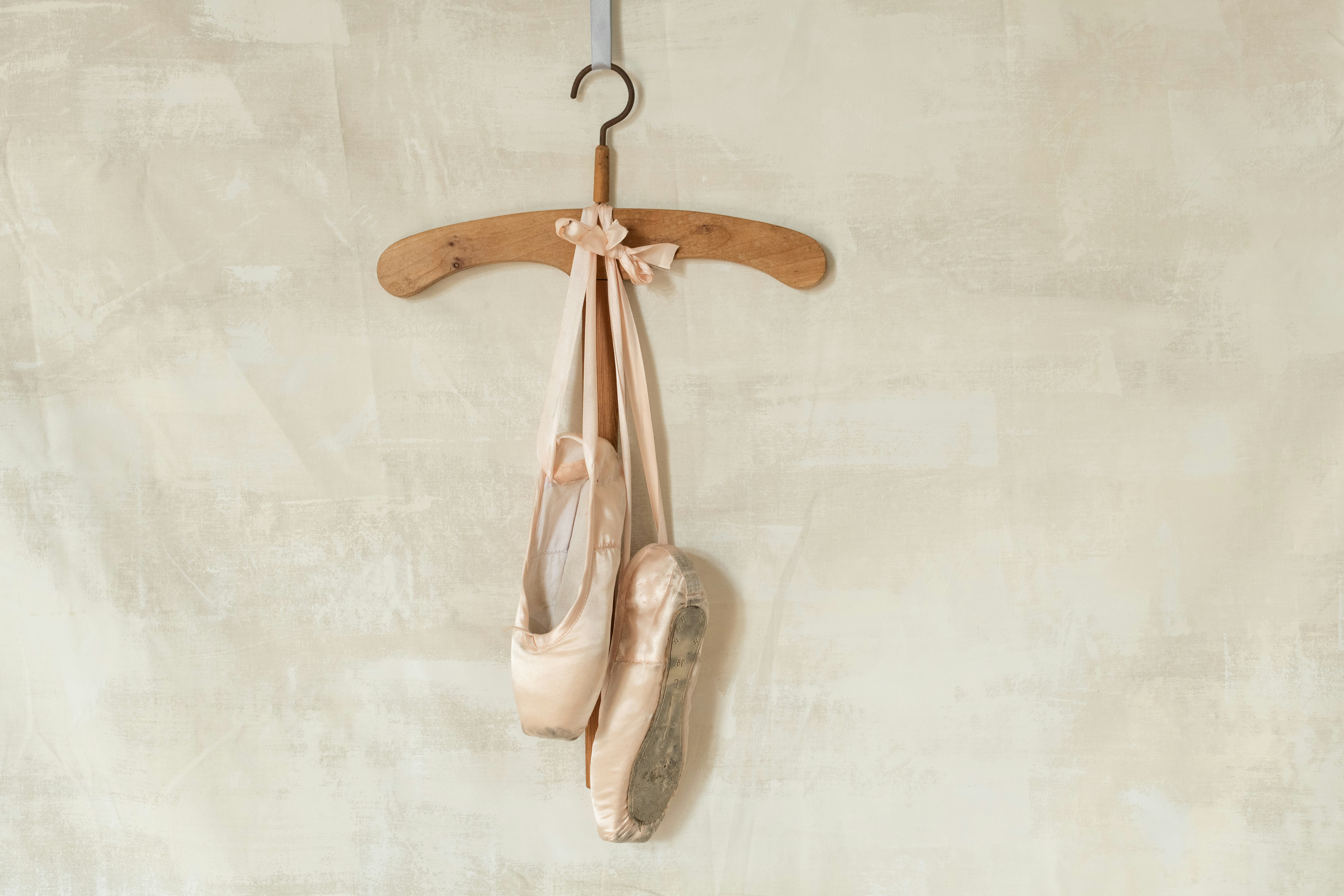 ballet slippers hanging on a wall adoption hopeful family waiting for baby girl